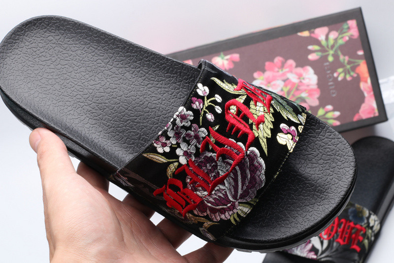 G*u*i slides all black with flower