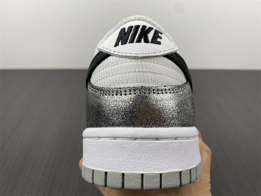 the nike dunk low features silver cracked leather do5882-001