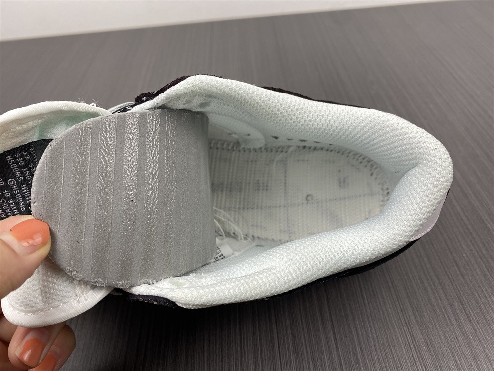 the nike dunk low features silver cracked leather do5882-001