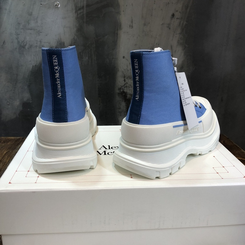 alex mcq tread slick boot in black