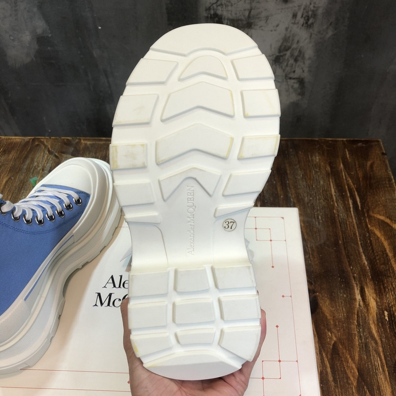 alex mcq tread slick boot in black