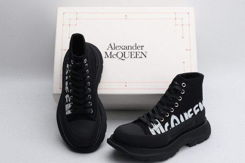 alex mcq tread slick boot in black with letters