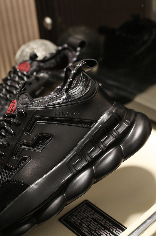 versace chain reaction triple black sneakers